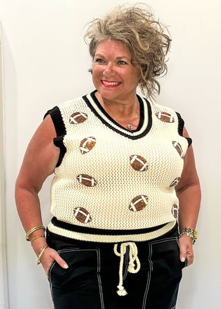 Cream open weave sleeveless sweater - need to wear something underneath - football sequin patches and black and cream varsity style trim around v-neck and bottom banding.
