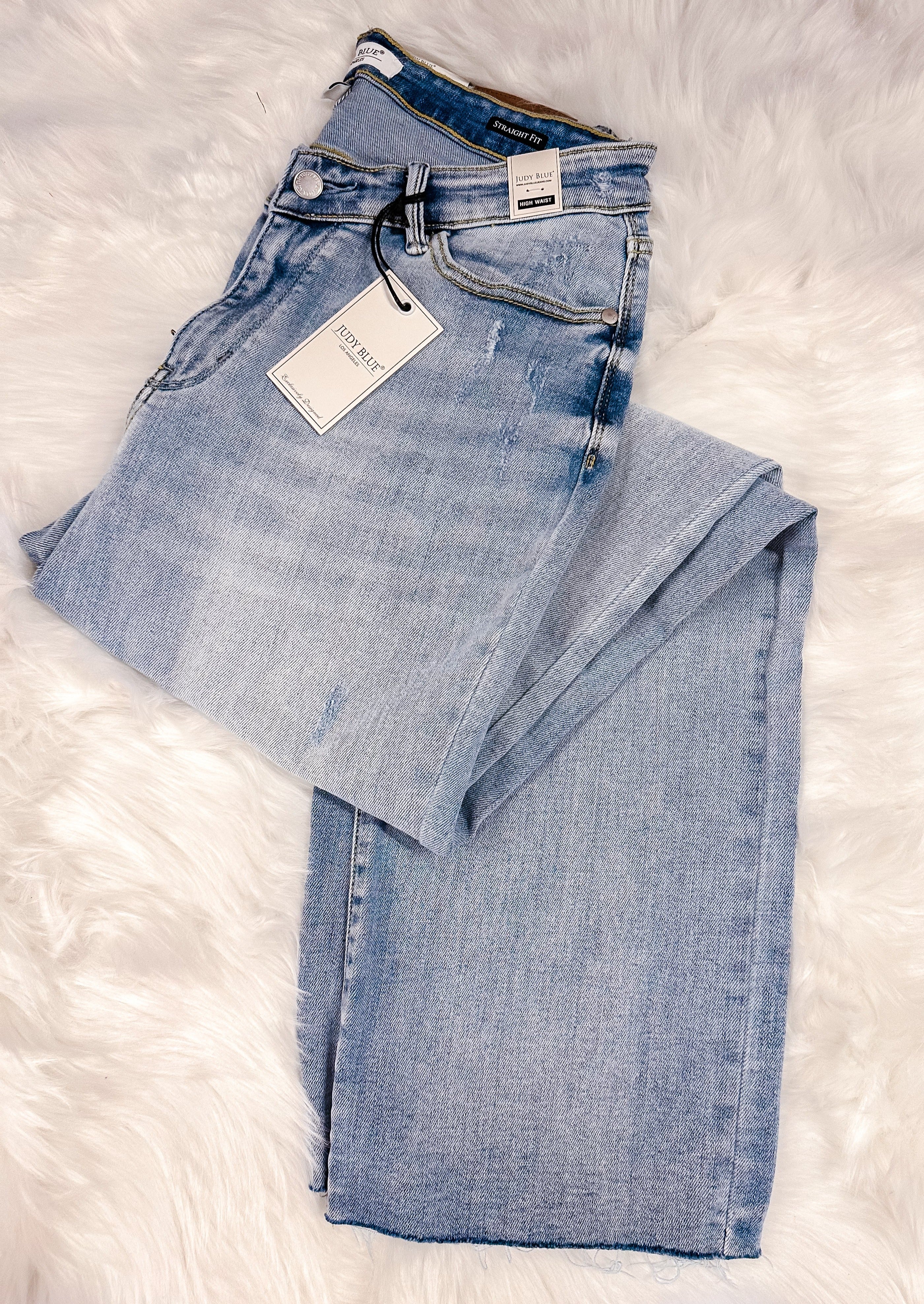 JUDY BLUE jeans with unfinished hem that can be cut to the length you want, light blue, button and zipper closure, front and back pockets, belt loops