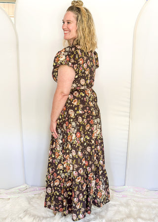 Brown with fall florals, short sleeve tiered maxi dress.  V-neck and puff sleeve and lined. 
