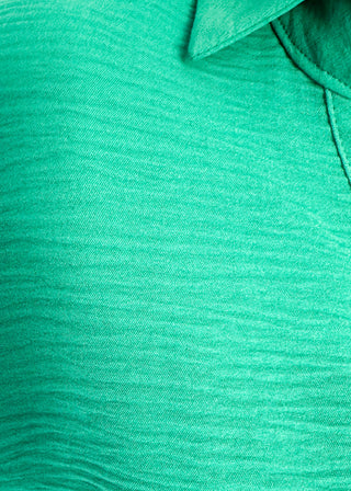 close up of green collared top with v-neckline 