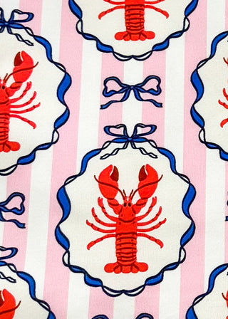 close up of pink and white stripe skort with crawfish