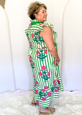 Green and white striped midi dress with pink floral print, flutter sleeves, contrast V-neckline, and a flowy tiered hem