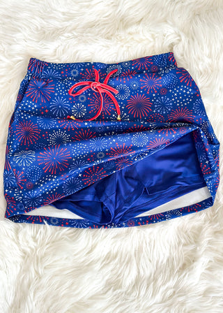 close up of red white and blue skort with elastic waistband, drawstring, and built-in shorts