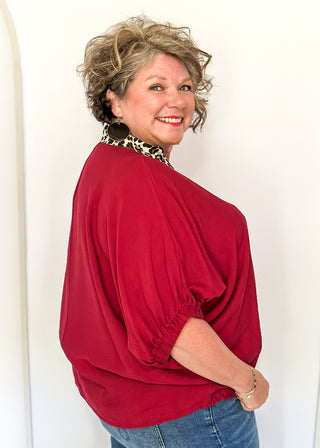 dolman short sleeve top in garnet color with double leopard stripe v-neck