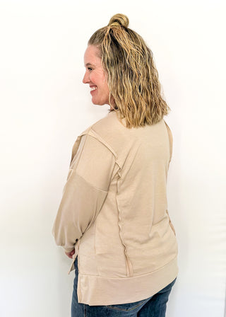 round neck oversized long sleeve with band cut edge detail with slits. 