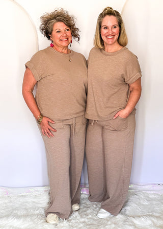 light brown two-piece lounge set with relaxed short sleeve top and wide-leg pants