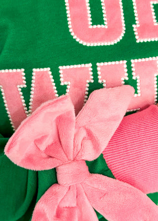 close up of velvet bow and letter patch detail