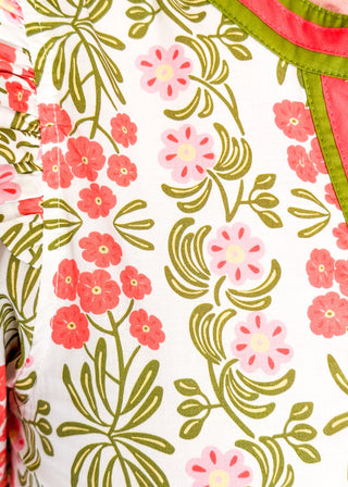 Floral midi dress with contrast neckline, short puff sleeves, and tiered skirt