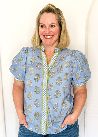 Short-sleeve blue floral button up top with contrast detailing