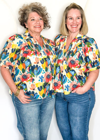 Multicolor floral blouse with smocked detail and short sleeves
