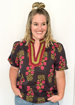 floral black -neck with ribbons of green and wine around v-neck and same colored floral pattern on  top - short sleeve