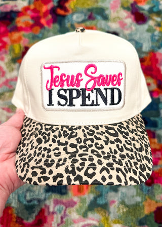 Ivory hat with leopard bill and “Jesus Saves I SPEND” embroidered patch in hot pink and black stitching. 