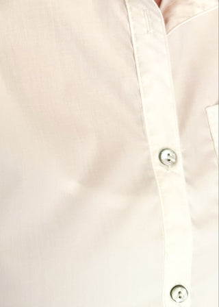 White button-up top with ruffle hem, short sleeves