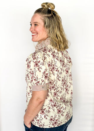Ivory with small rust colored florals-short sleeve button up top. Rust and ivory stripe ruffle collar and sleeve binding.  