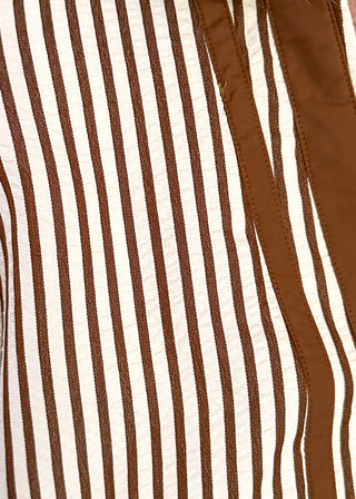 close up of brown and cream striped dolman-sleeve top with contrast trim