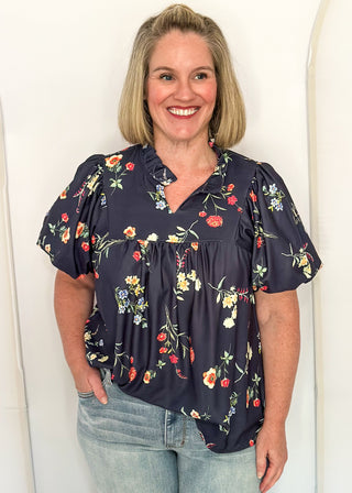 woman in Navy flower blouse
