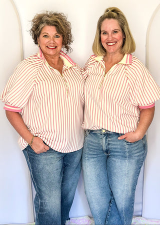 Women’s pink striped short sleeve 1/4 zip top with lightweight fabric, stripe elastic sleeve and collar detail.