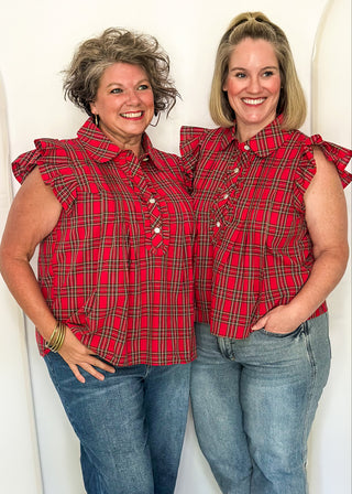 Two women wearing red plaid shirt with flutter sleeves and rhinestone buttons.