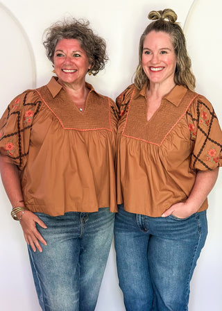 models in chestnut poplin puff sleeve top with embroidery. 