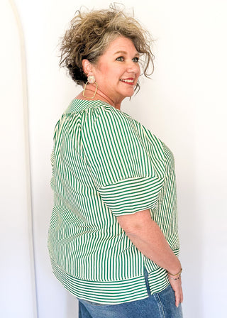 Green striped blouse with lightweight seersucker fabric, short sleeves, and relaxed shape.