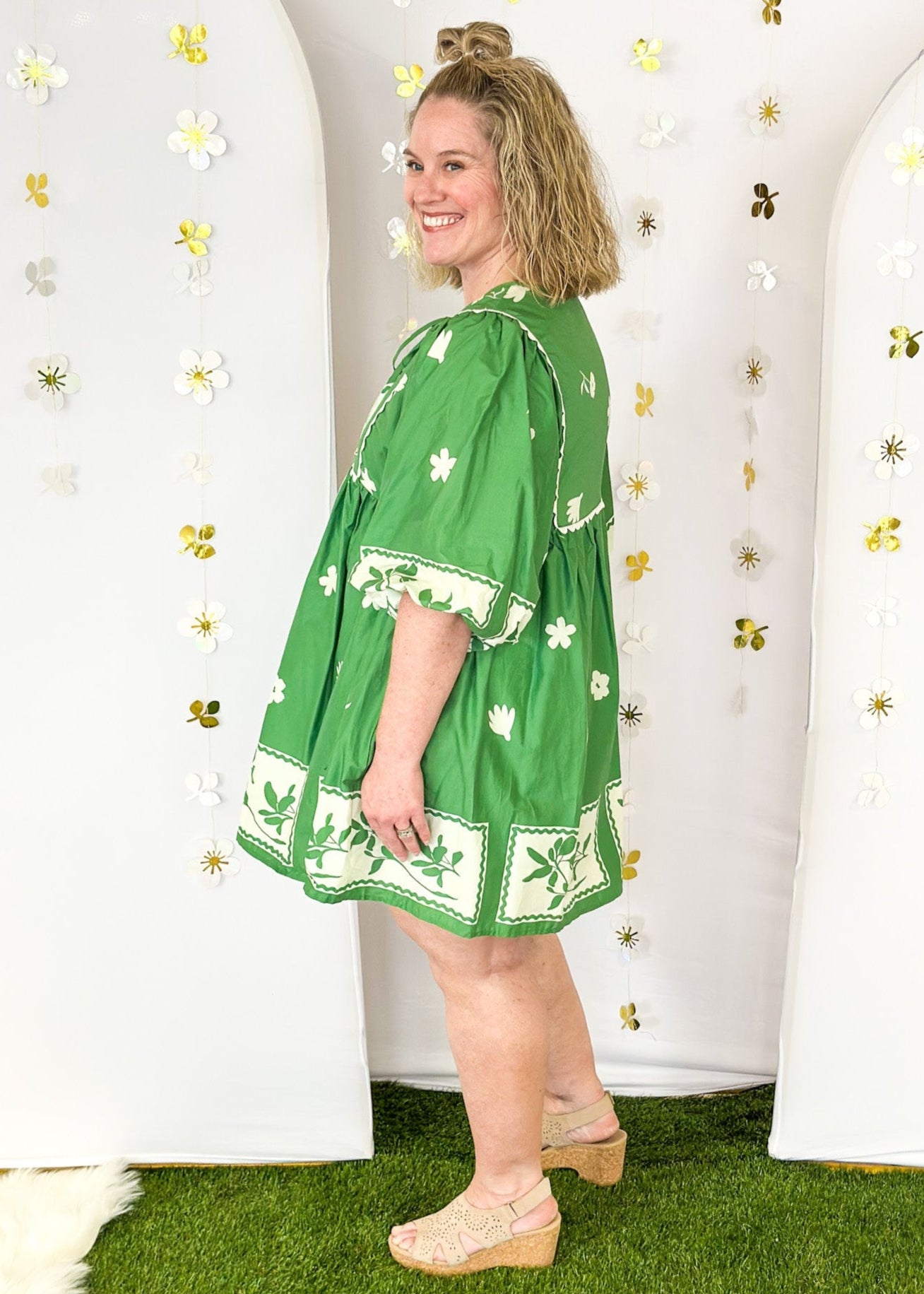 green base with off white flower pattern lined 3/4 sleeve babydoll dress  w/tie front and oversized balloon sleeve - scalloped trim detail on the front and pockets.