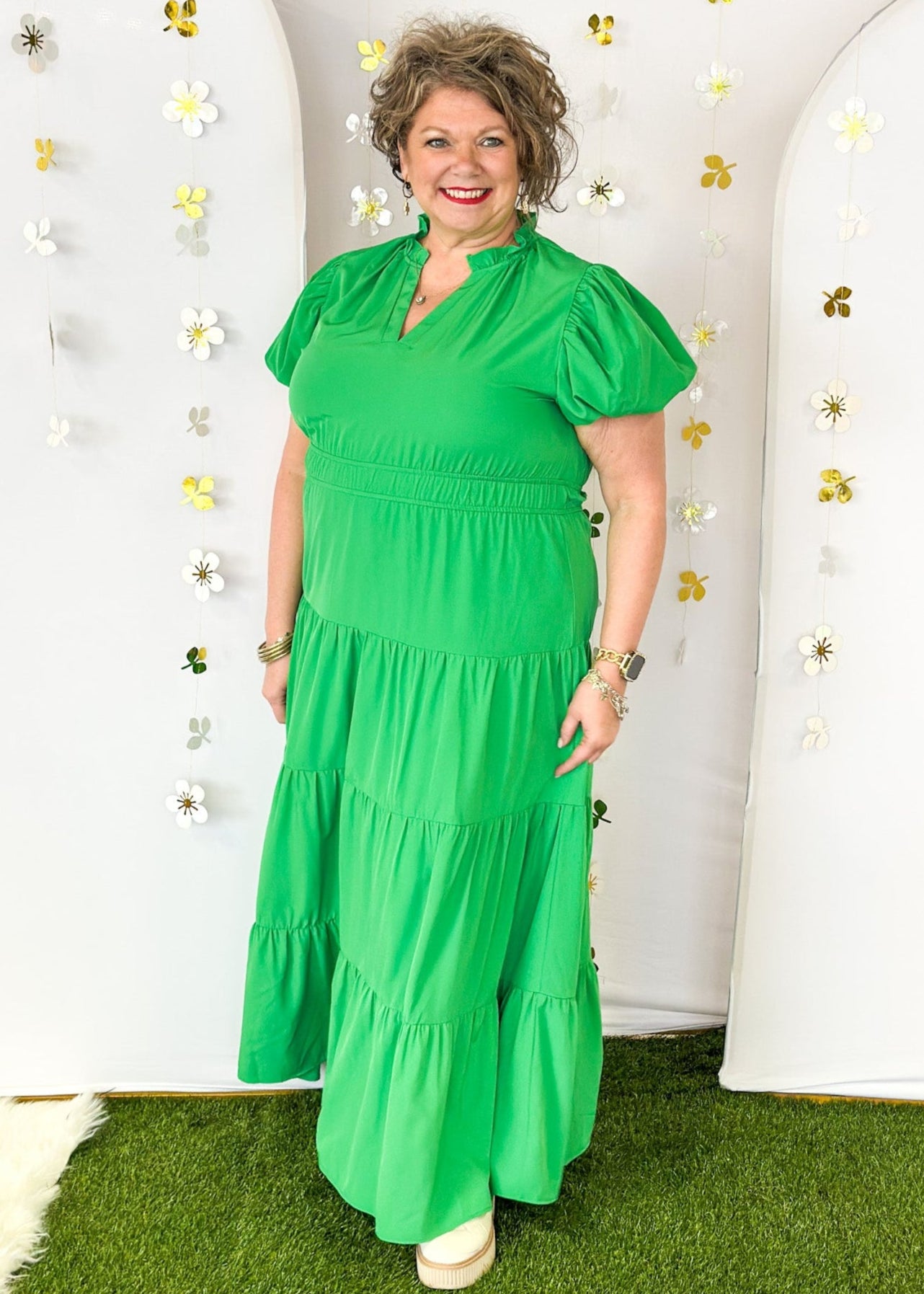 Solid green tiered maxi dress with puff sleeve. and cinched waist.  V-neck with small ruffle collar. Lined.