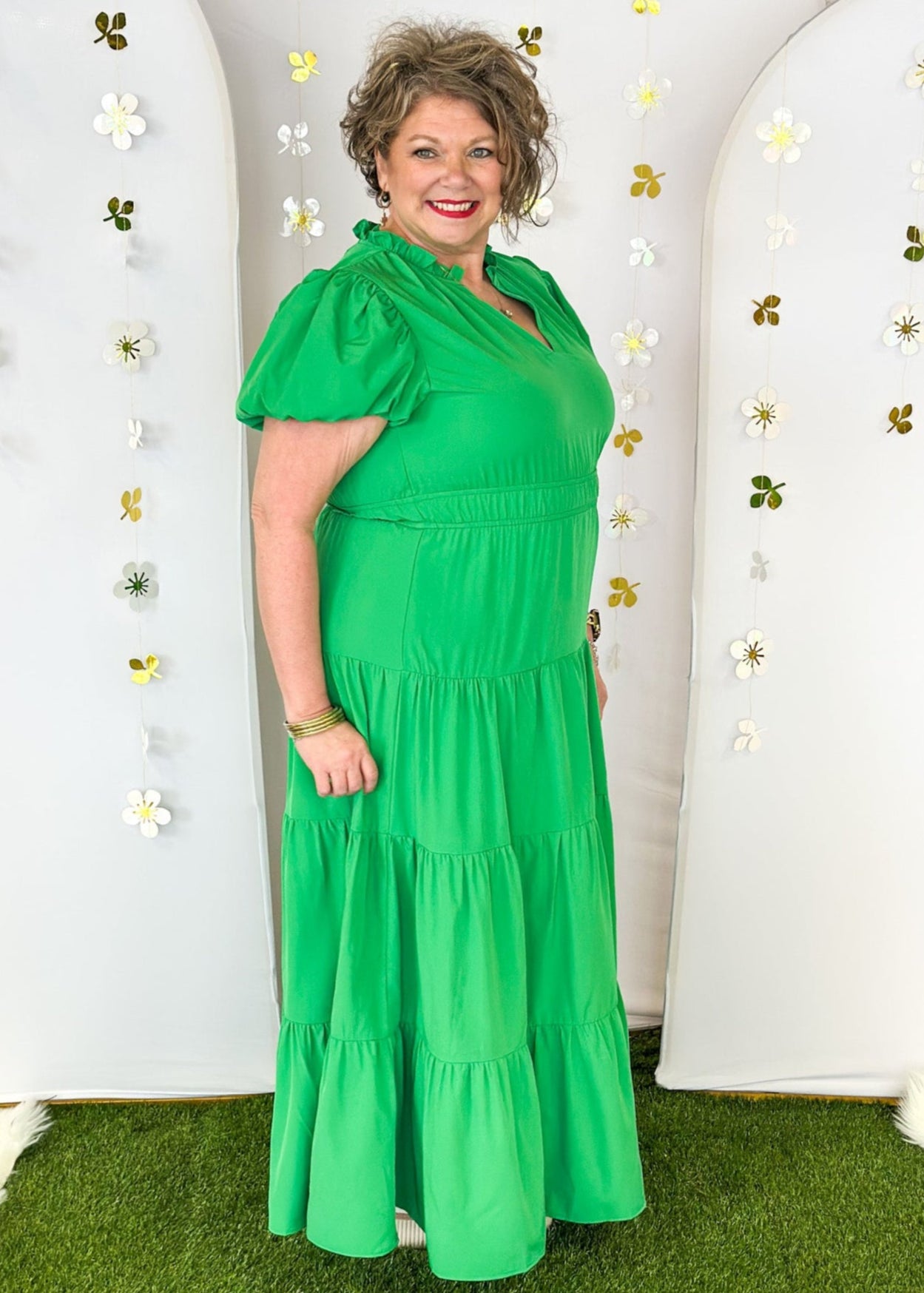 Solid green tiered maxi dress with puff sleeve. and cinched waist.  V-neck with small ruffle collar. Lined.