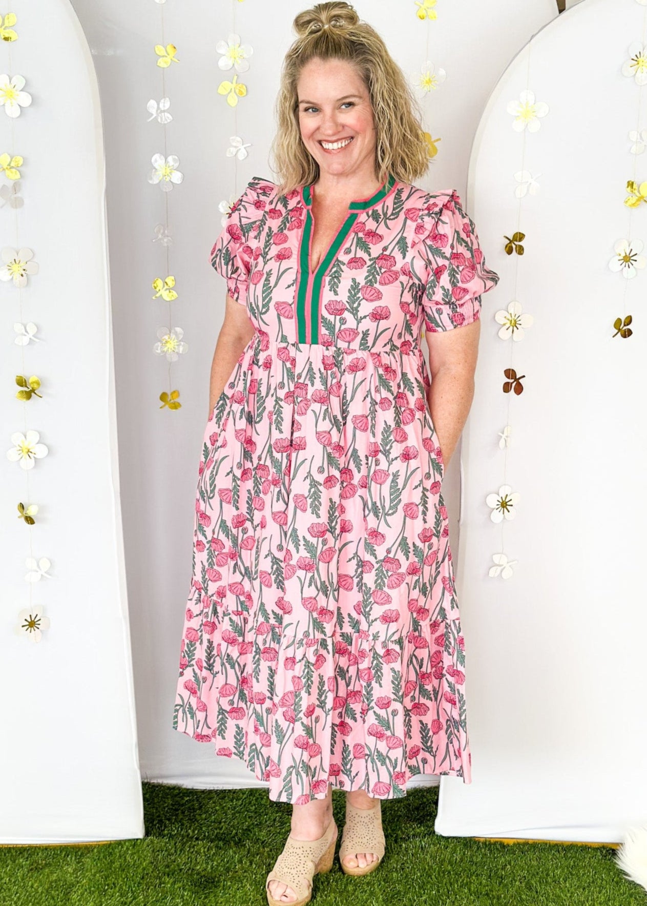 Pink and green floral midi dress.  V-neck with pink and green striped collar.  Puff sleeve-lined with pockets. 