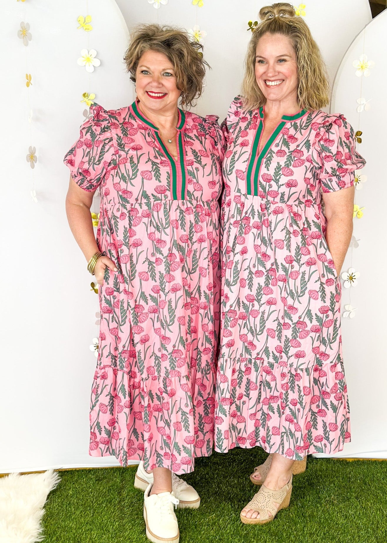 Pink and green floral midi dress.  V-neck with pink and green striped collar.  Puff sleeve-lined with pockets. 