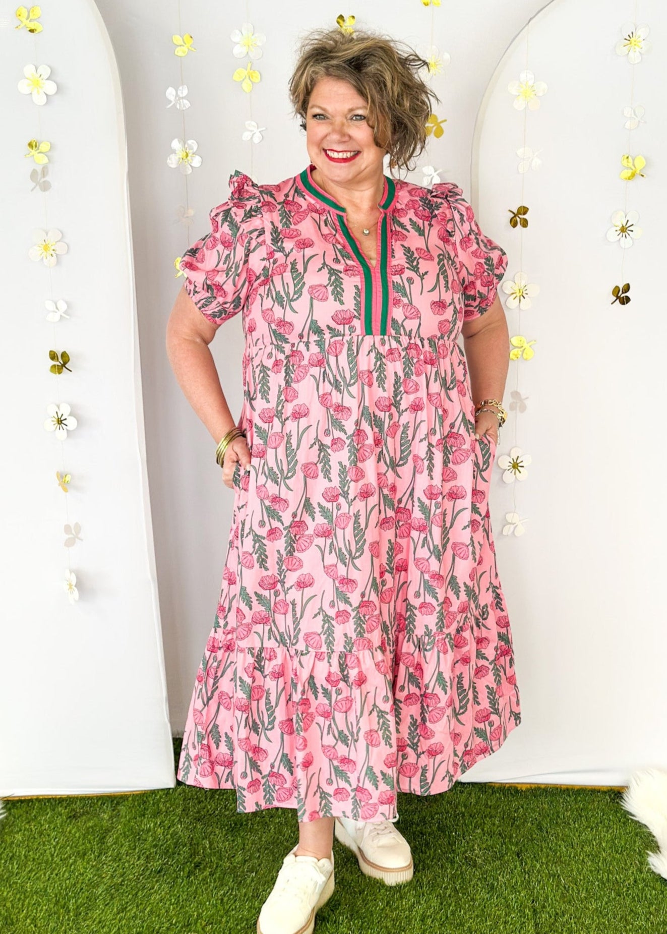 Pink and green floral midi dress.  V-neck with pink and green striped collar.  Puff sleeve-lined with pockets. 