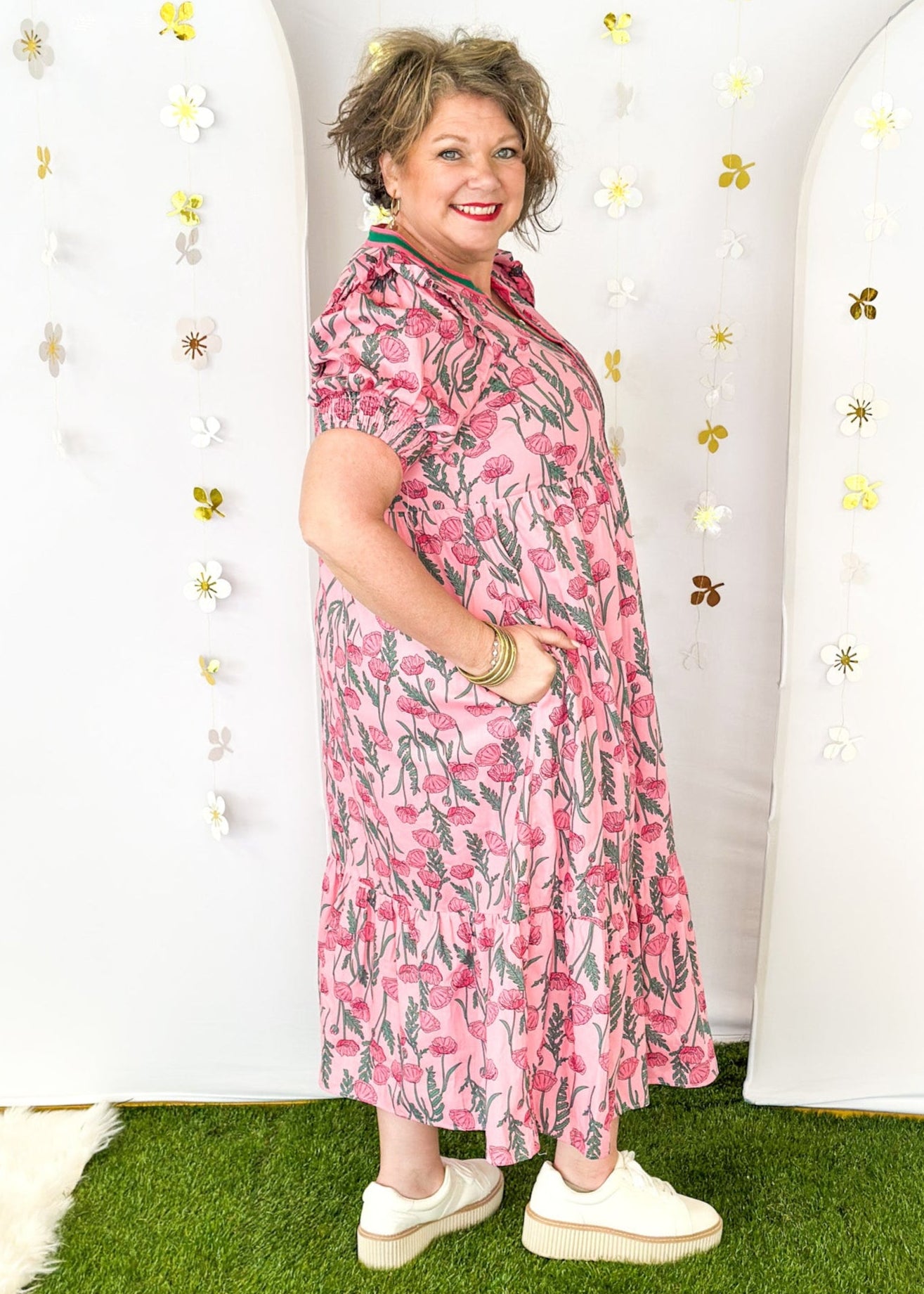 Pink and green floral midi dress.  V-neck with pink and green striped collar.  Puff sleeve-lined with pockets. 