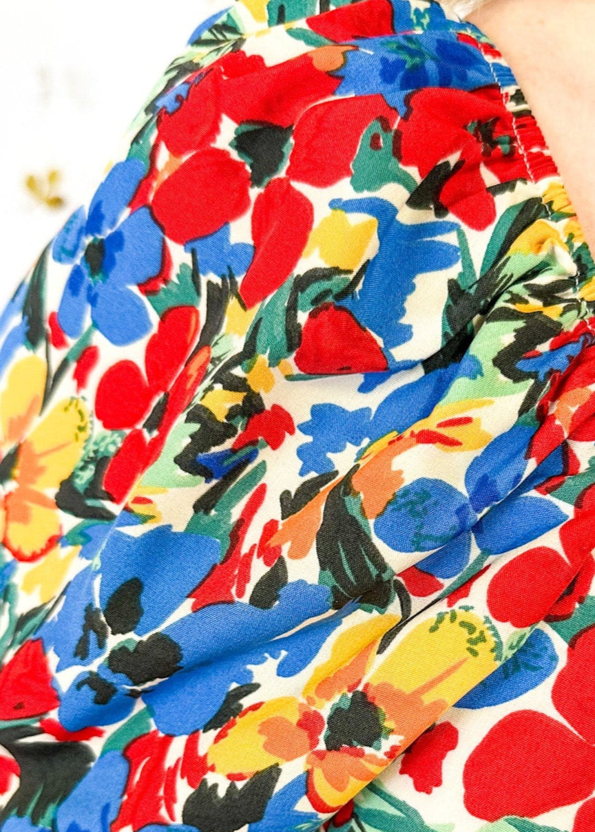 Short Sleeve midi dress with square neck line.  Bright florals in Red, Blue and yellow. 