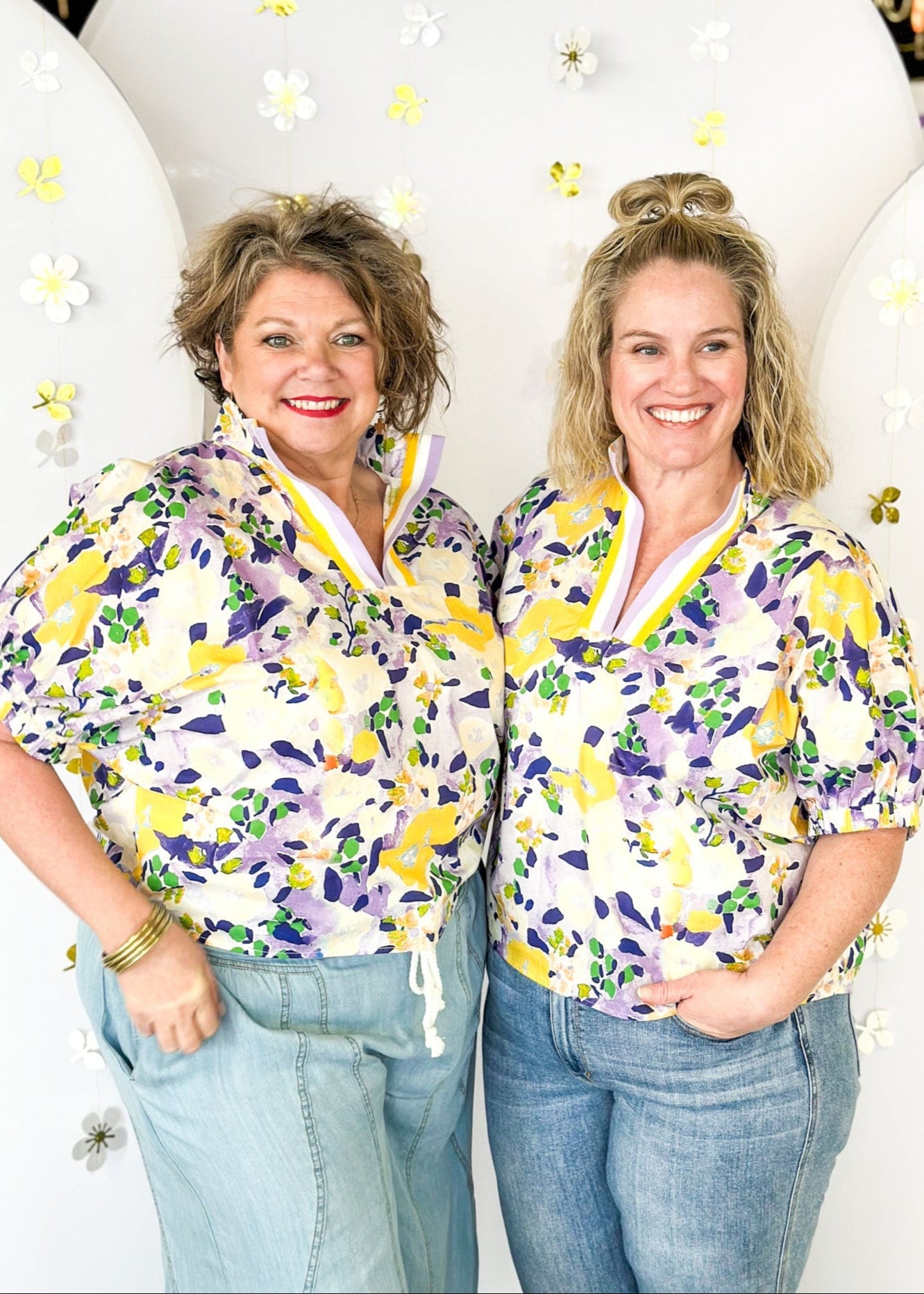 floral print short sleeve top in purple and yellow-with striped v-neck collar and elastic cuff on sleeve 