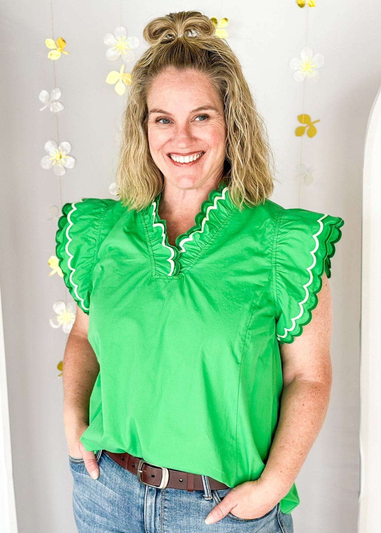 Solid kelly green short sleeve ruffle top.  Double ruffle around the sleeve and collar stitched in dark green and white.  