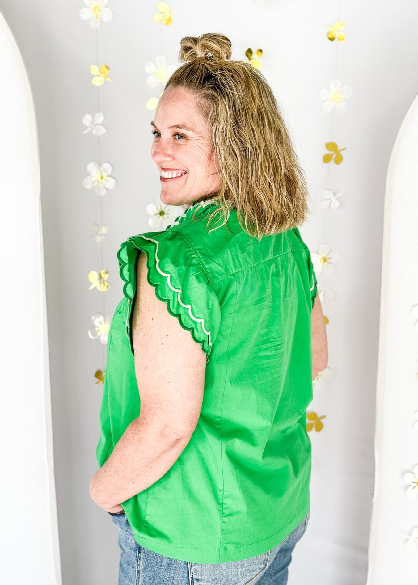 Solid kelly green short sleeve ruffle top.  Double ruffle around the sleeve and collar stitched in dark green and white.  