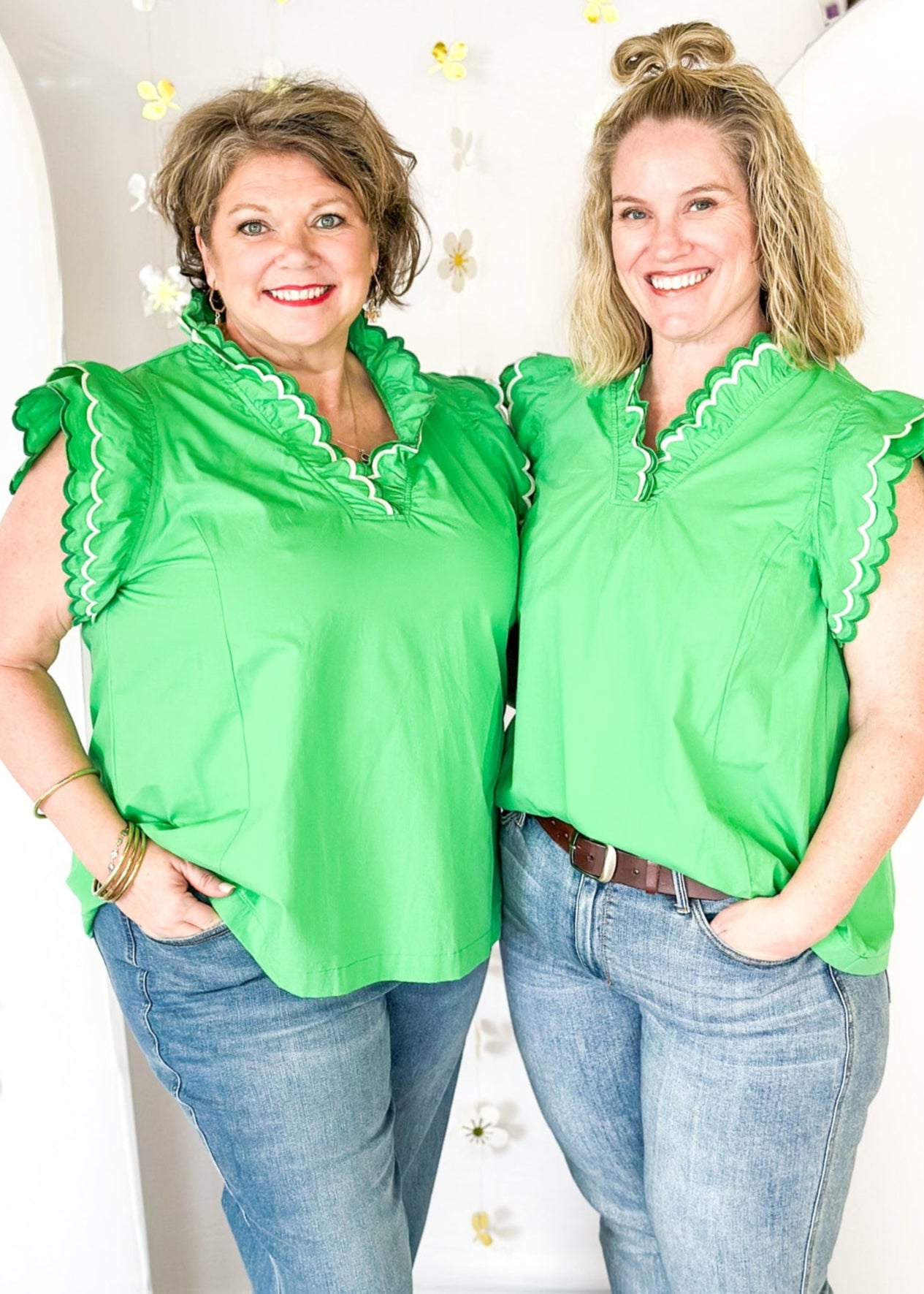 Solid kelly green short sleeve ruffle top.  Double ruffle around the sleeve and collar stitched in dark green and white.  