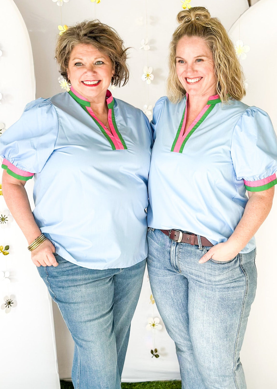 chambray v-neck short puff sleeve top with contrast striped banding around cuff and neck in pink and green