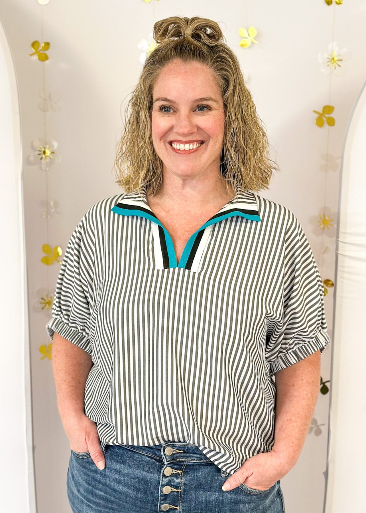 faded black and white vertical striped dolman sleeve top with elastic around sleeve cuff - turquoise white and black stripe on v-neck/collar 