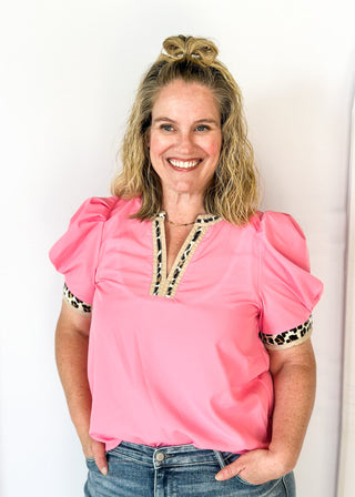 pink puff short sleeve top w/leopard and tan trim around v-neck and cuff