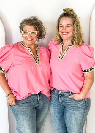 pink puff short sleeve top w/leopard and tan trim around v-neck and cuff