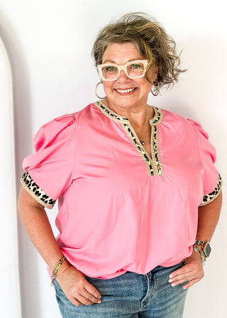 pink puff short sleeve top w/leopard and tan trim around v-neck and cuff