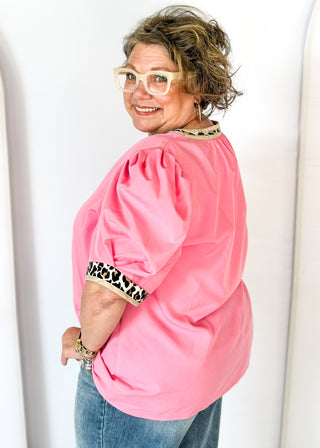 pink puff short sleeve top w/leopard and tan trim around v-neck and cuff