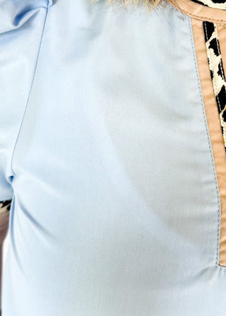 light blue puff short sleeve top w/leopard and tan trim around v-neck and cuff
