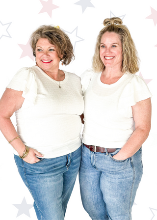 Lightweight textured short sleeve solid white top.  Round neck and ruffle sleeve.  