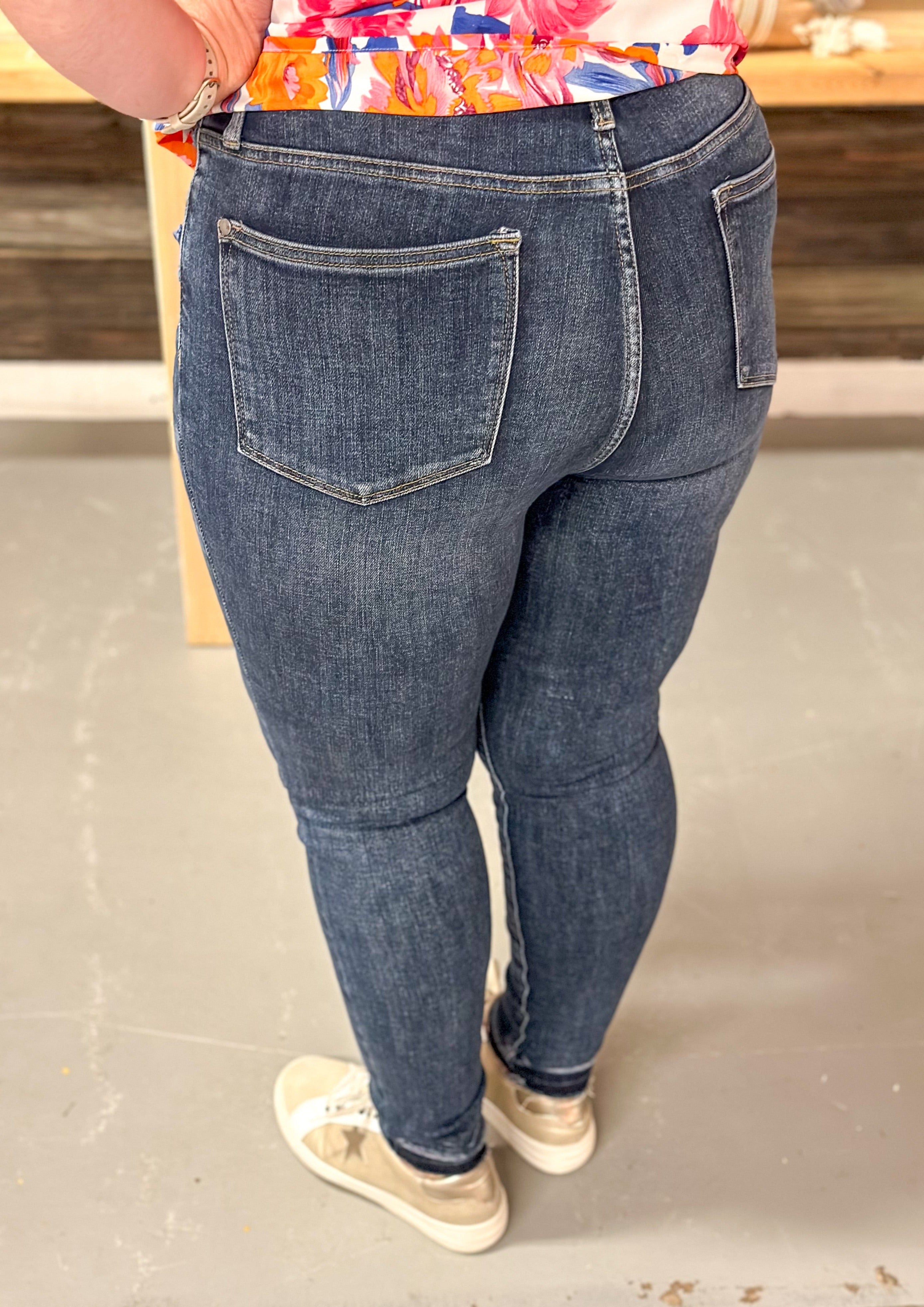 Judy Blue Unfinished Hem Hi Rise Tummy Control Skinny Jean with front and back pockets, zipper and front button closure