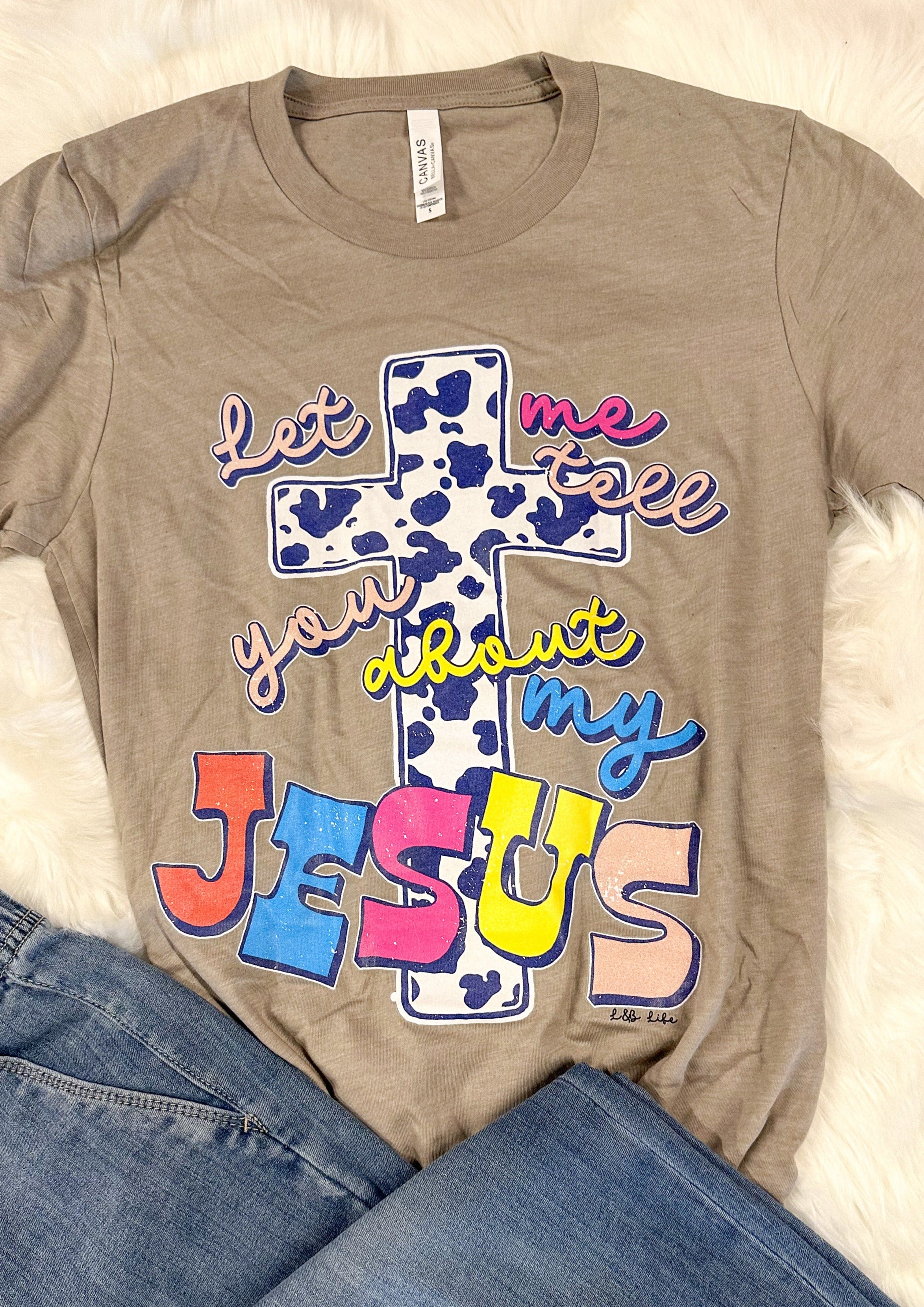 Let Me Tell You About My Jesus Tee Shirt - Stone color shirt with cow bring cross and multi colored writing - short sleeve