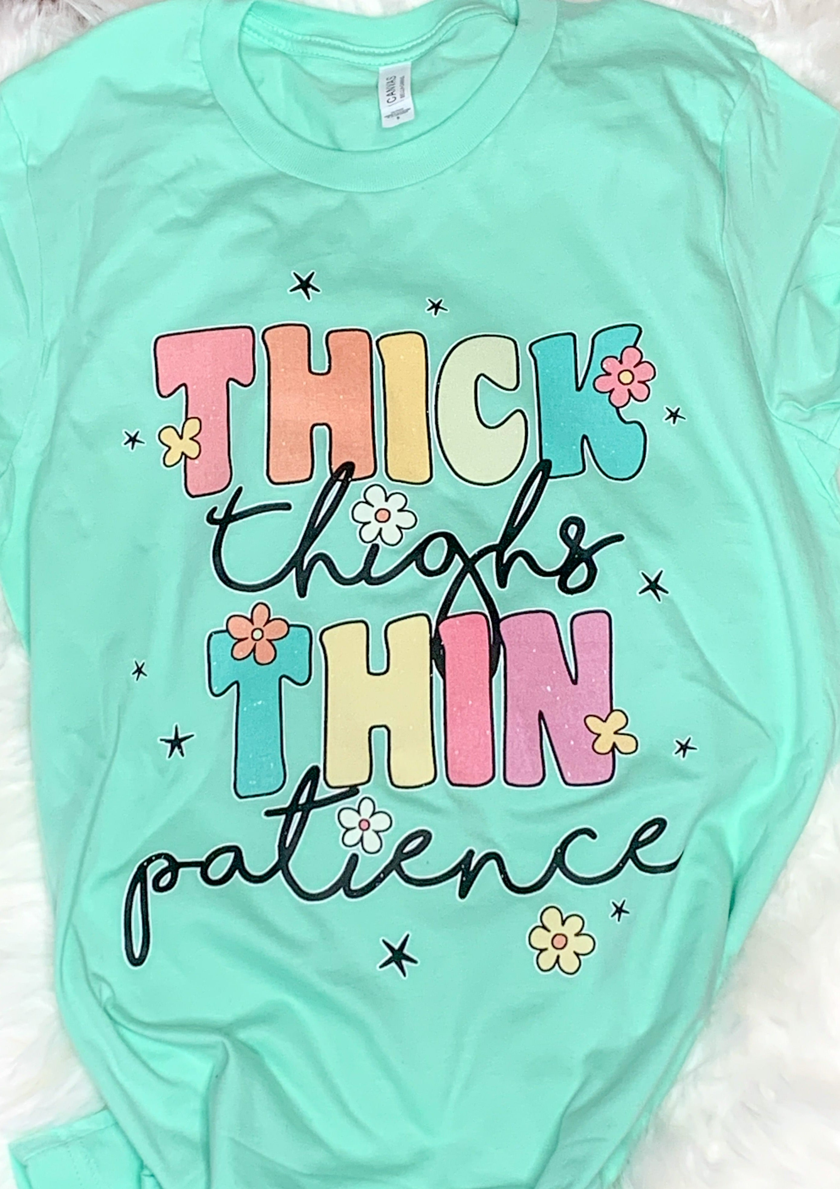 Mint green bella canvas tee with saying "thick thighs thin patience"
