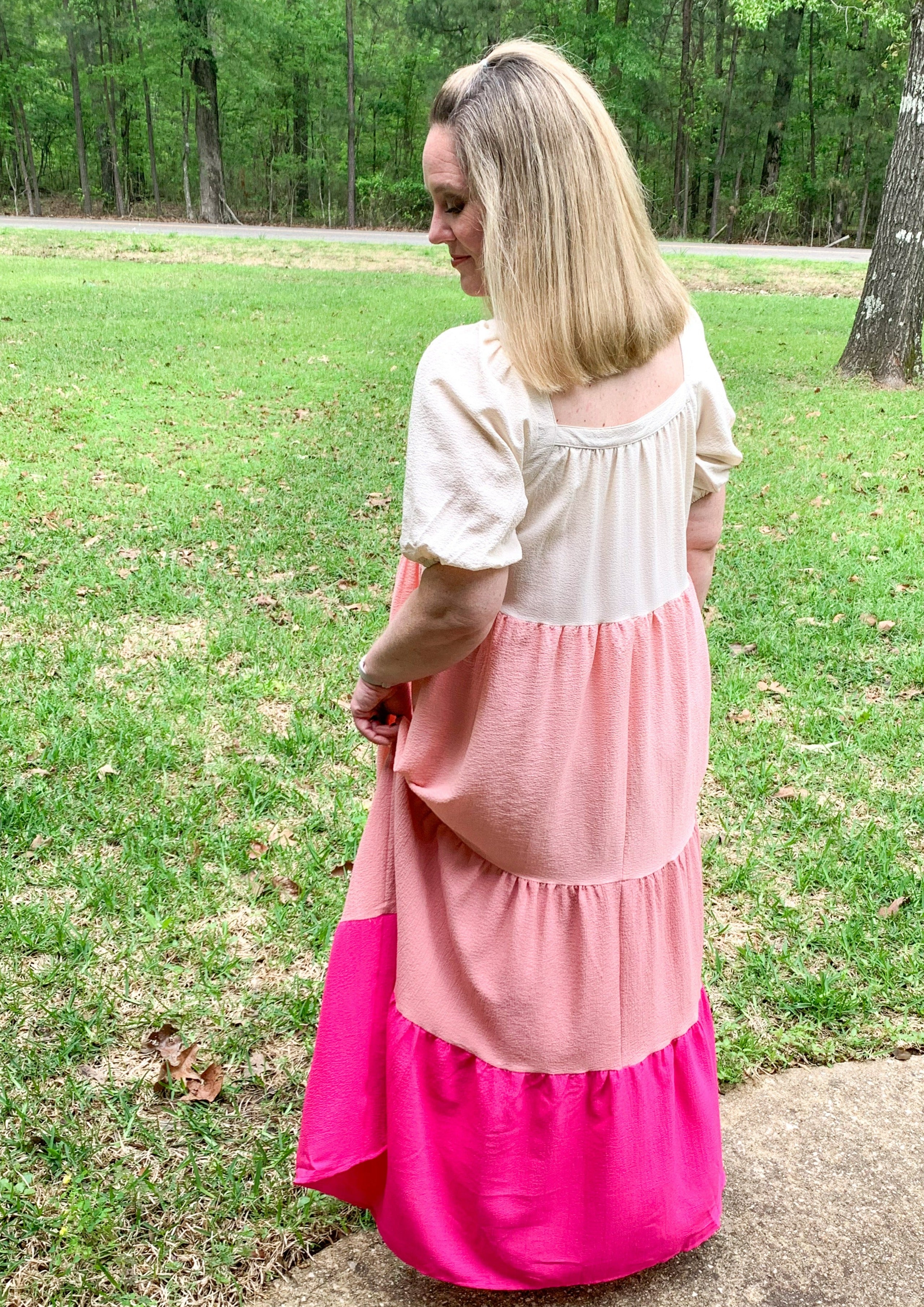 Puff sleeve tiered full length maxi dress. Color of tiers from top to bottom: Cream, light pink, blush, hot pink