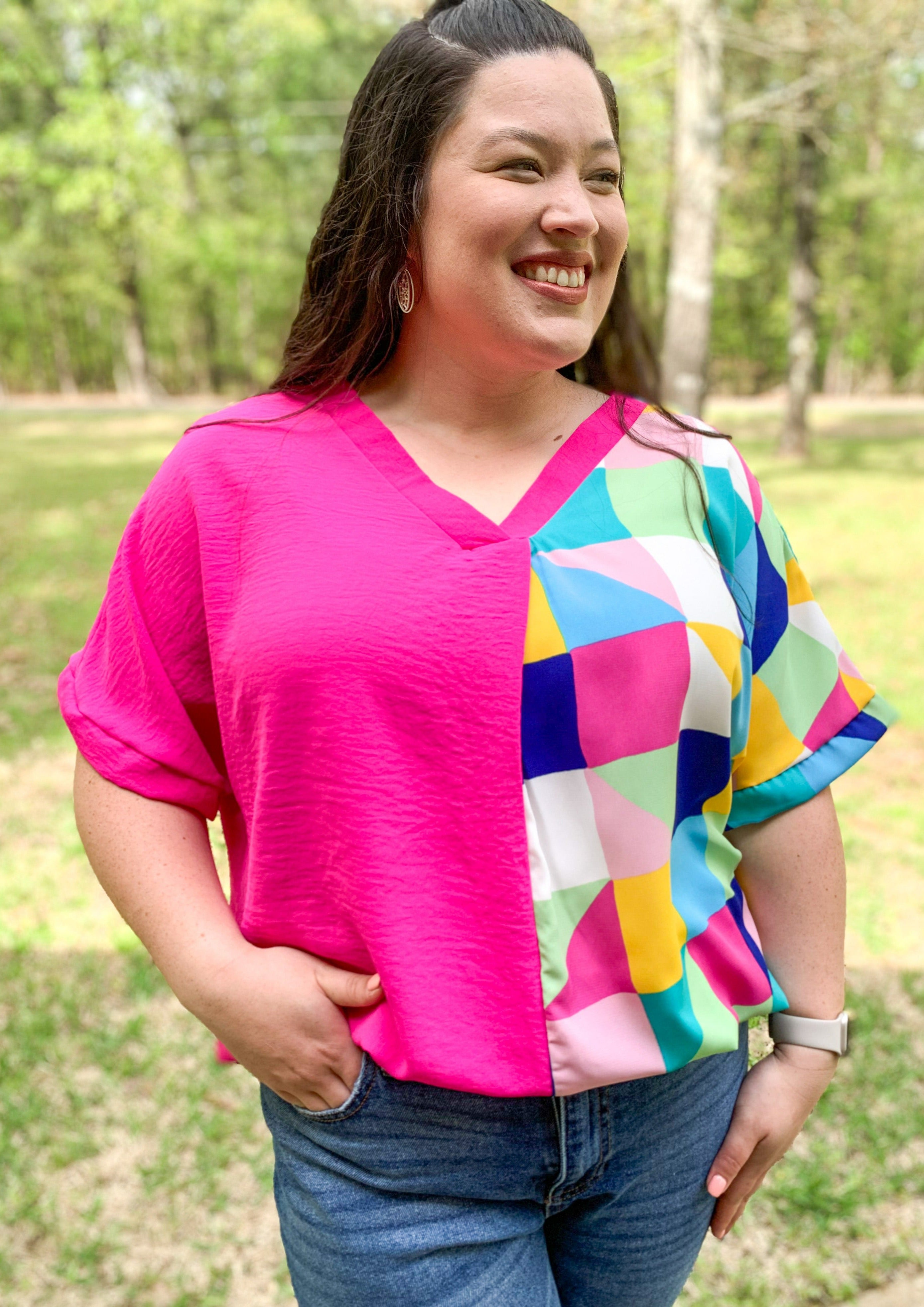 Geometric and Fuchsia V Neck Top hot pink on one side and multicolored triangles on the other side